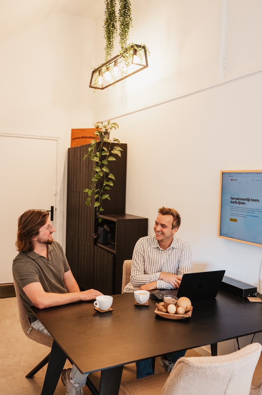 Pascal van de Braak and Gerwin Morren of Next Win discussing a custom software project